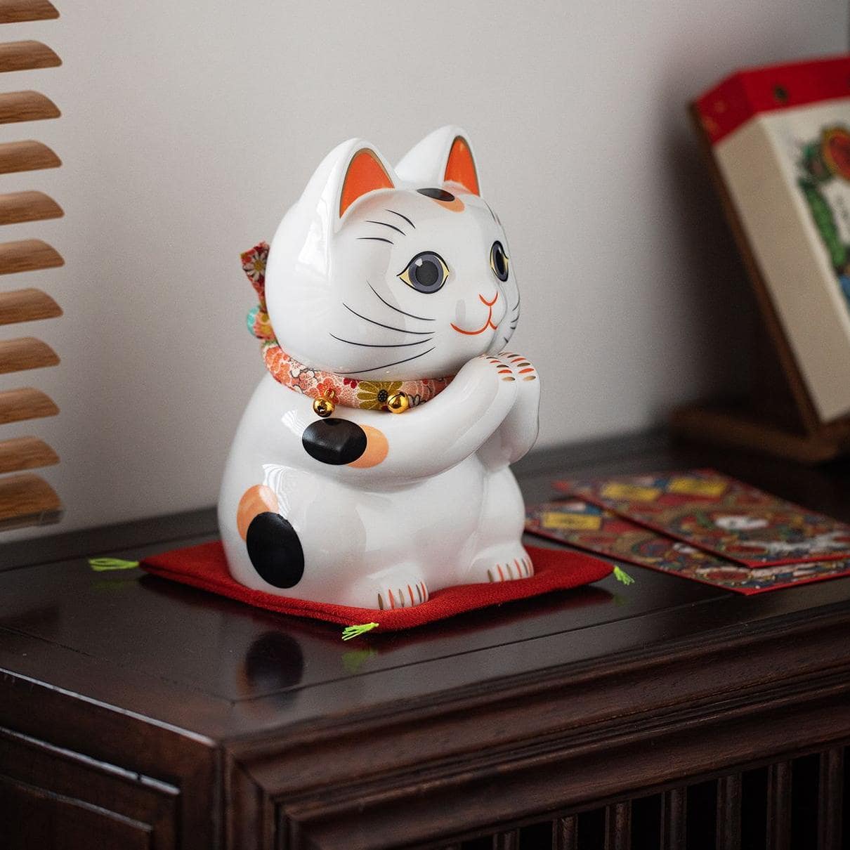 Set of Japanese-style ceramic lucky cats for home decor.