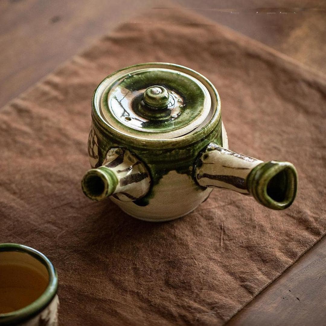 Elegant Oribe-style teapot for traditional Kung Fu tea rituals.