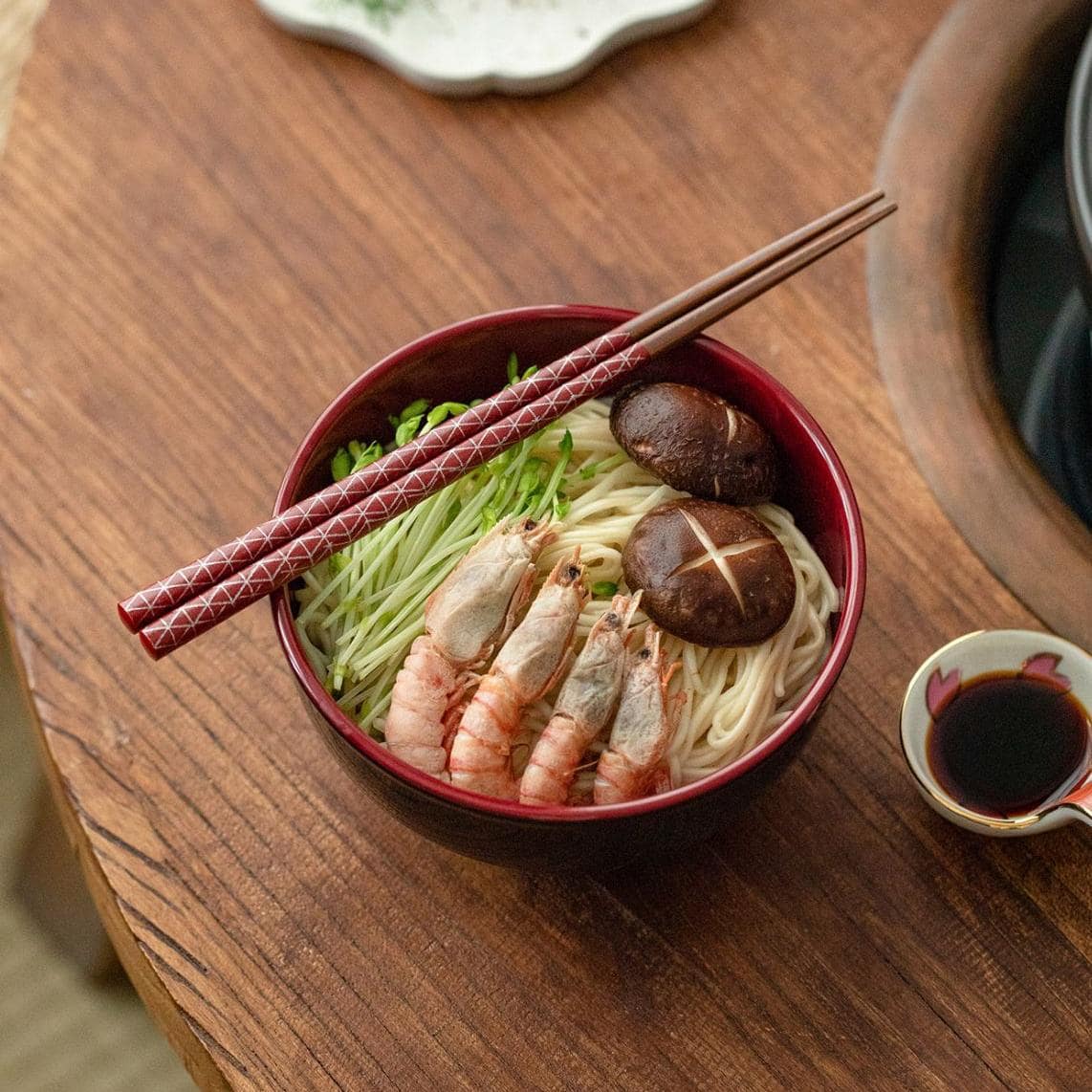 Elegant Japanese tableware chopsticks on a ceramic plate.