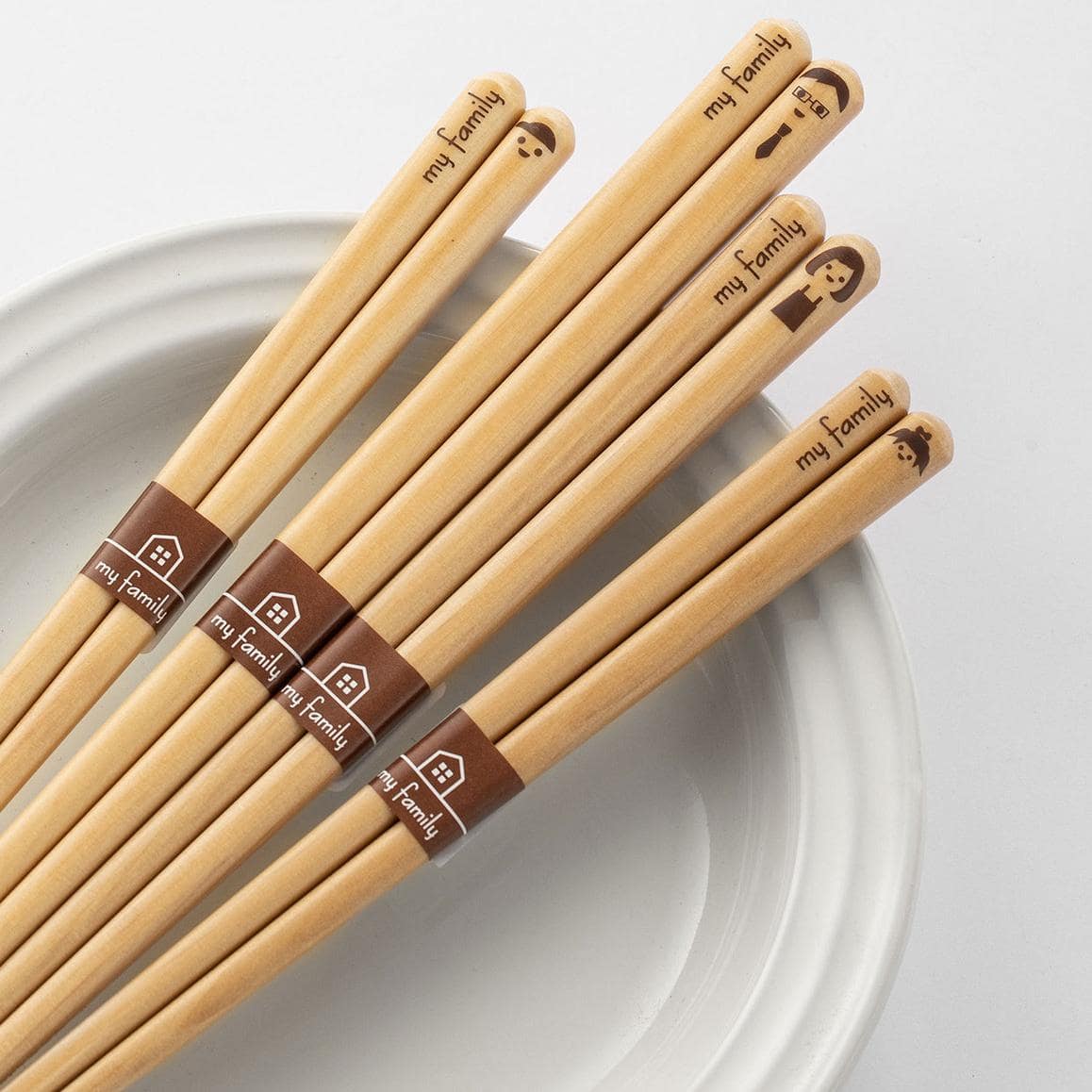 Family-themed bamboo chopsticks with unique designs.