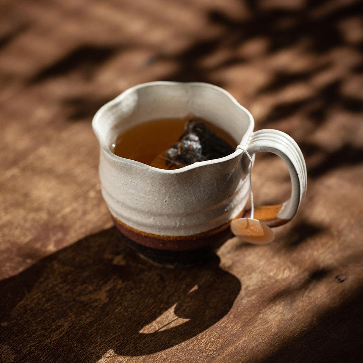 Rustic ceramic tea cups on a minimalist background