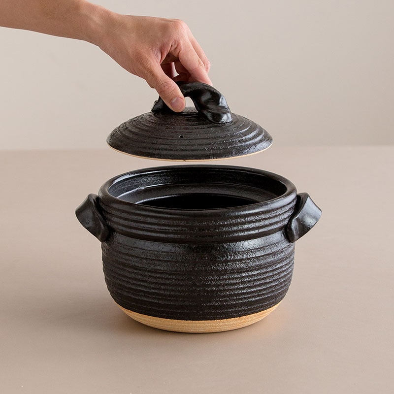 Authentic Japanese soup pot with knot-style lid and ergonomic handles