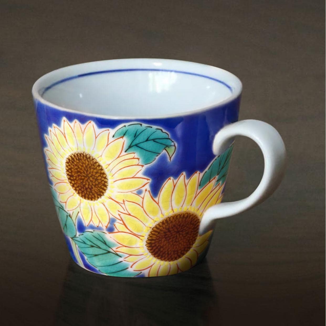 Pair of artistic ceramic mugs featuring floral designs