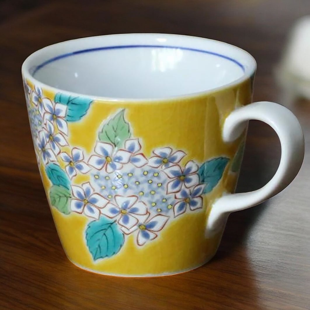 Vibrant cherry blossom mug with intricate hand-painted details