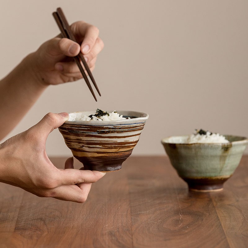 Two artisan bowls showcasing unique natural designs