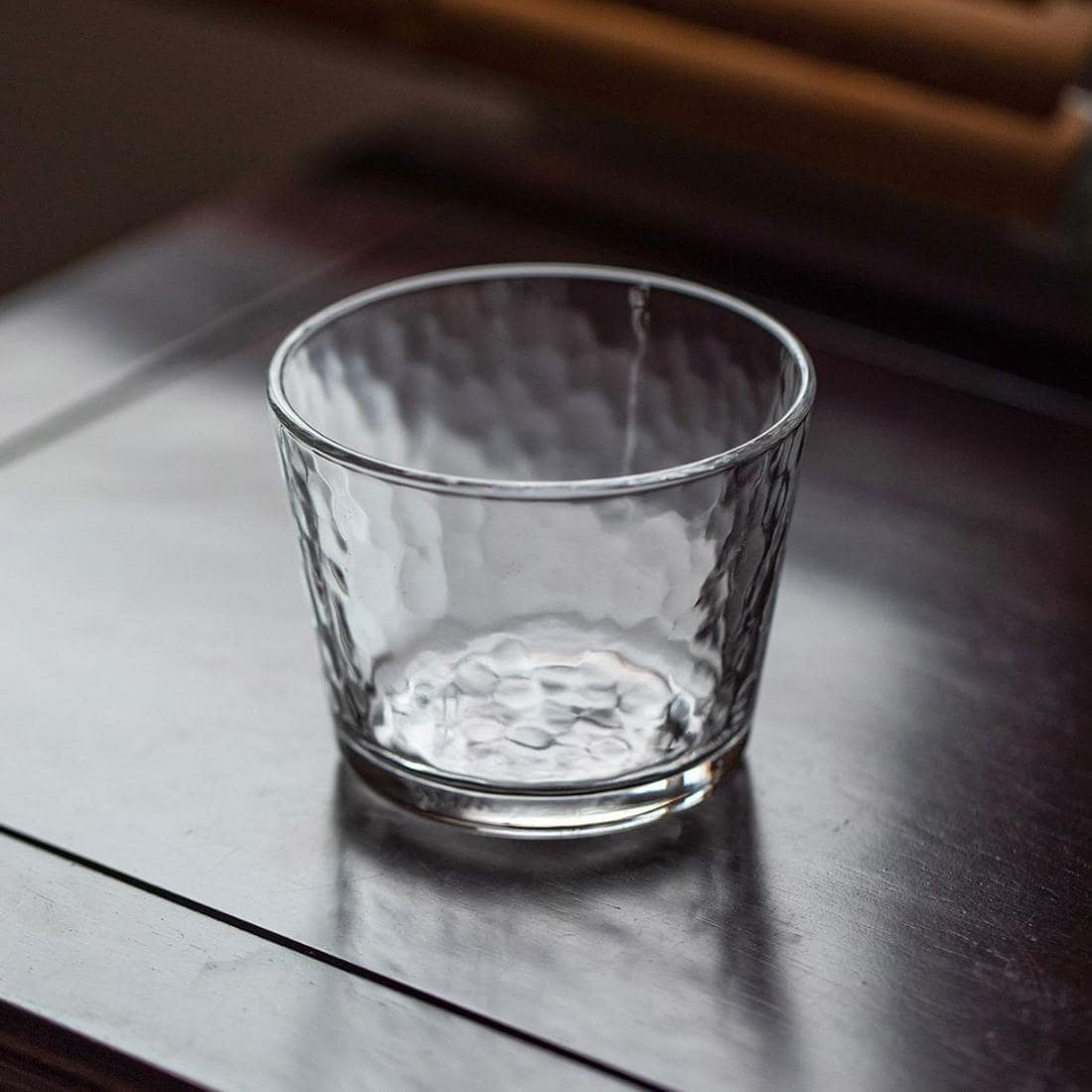 Pair of clear and amber glass cups for stylish drinkware options.