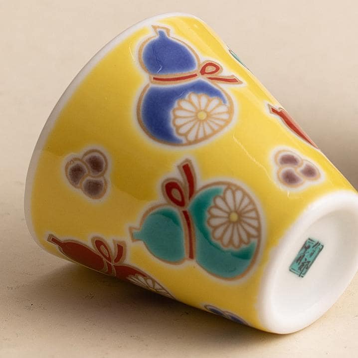 Close-up of a traditional Japanese sake cup with geometric design