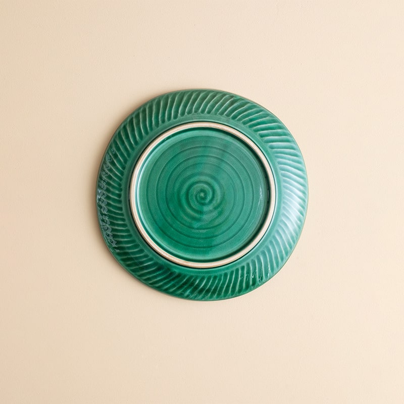 Artistic serving plate with ice crack pattern and vibrant green finish.