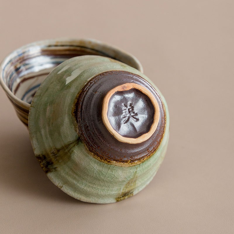 Close-up of green ceramic bowl with detailed texture