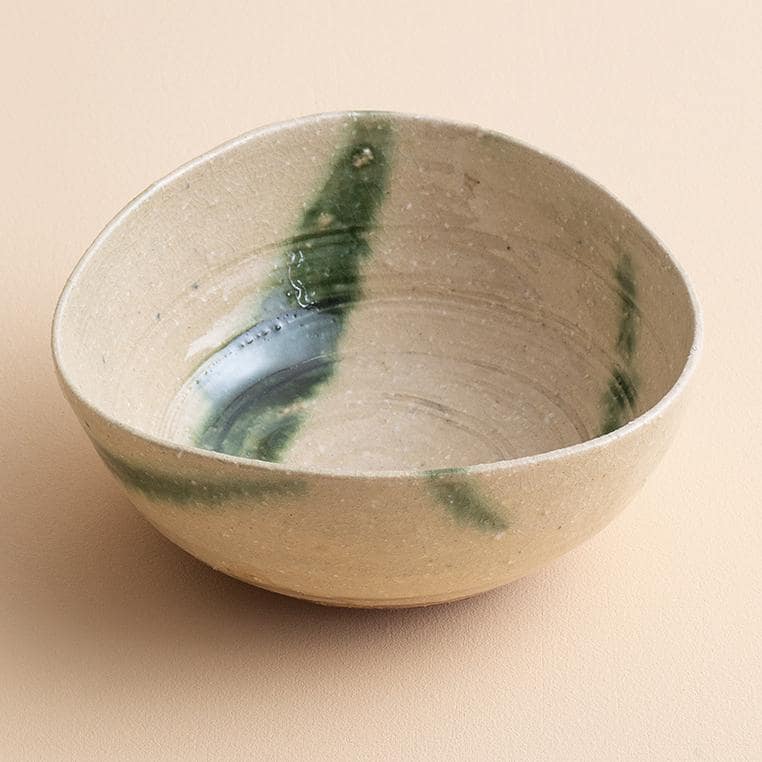 Handcrafted artisan ceramic bowl on rustic table