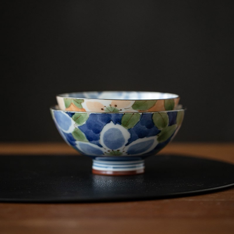 Peach and green floral ceramic bowl close-up