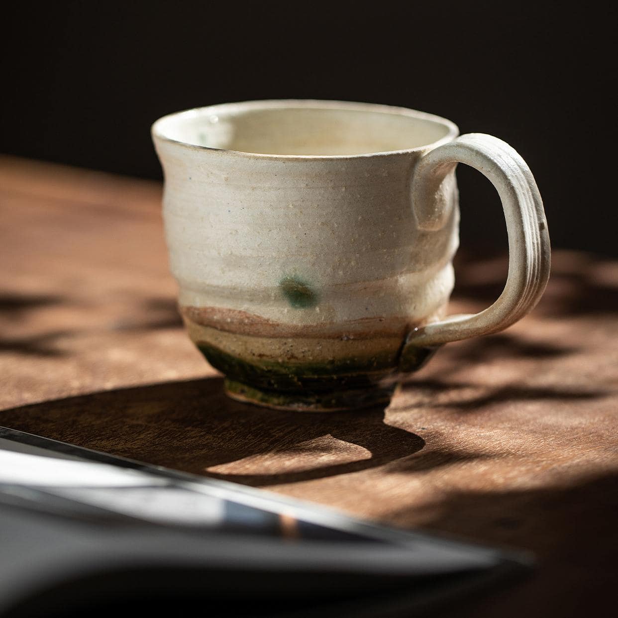 Rustic ceramic tea cups on a minimalist background