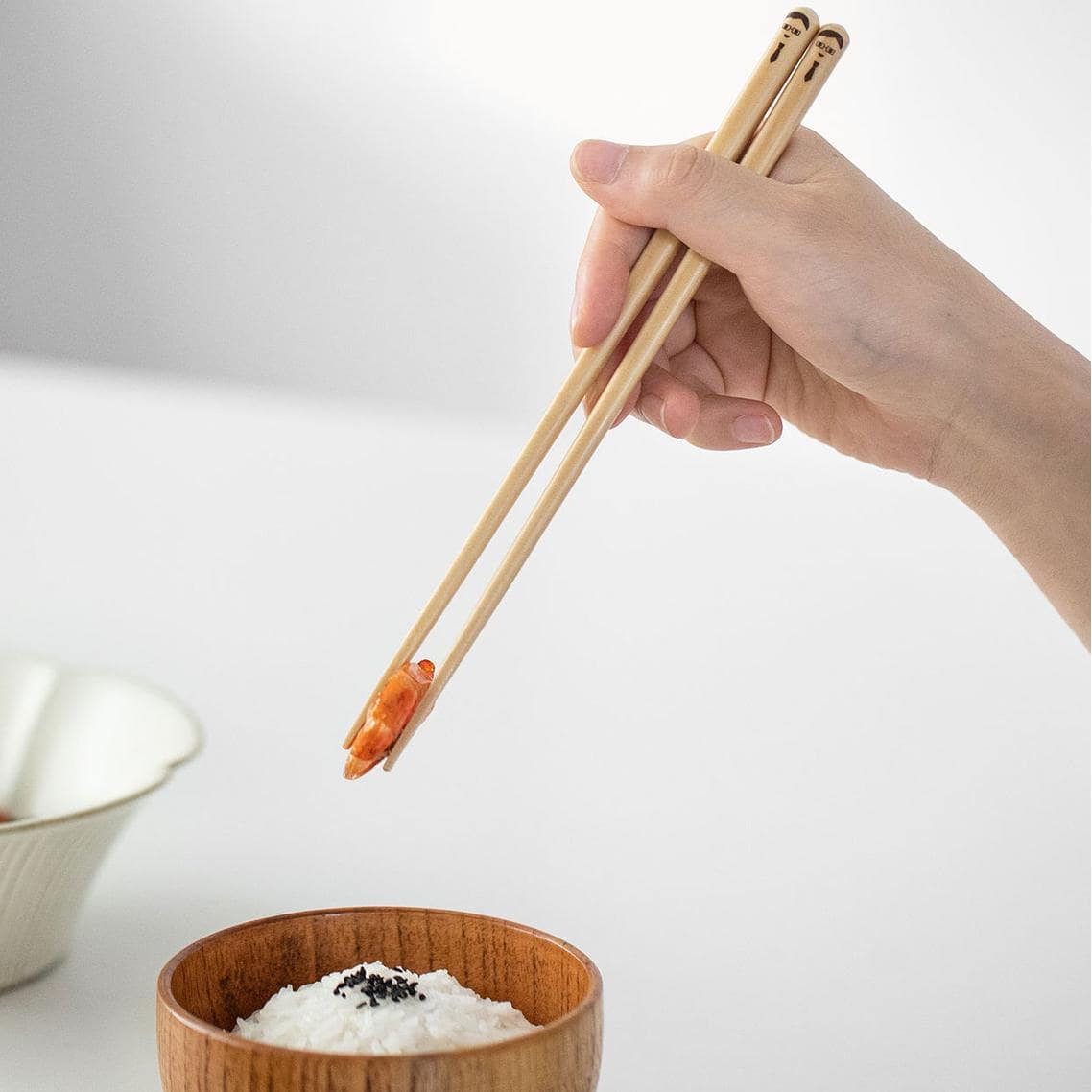 Family-themed bamboo chopsticks with unique designs.