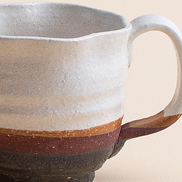 Artisan ceramic mugs with unique textures