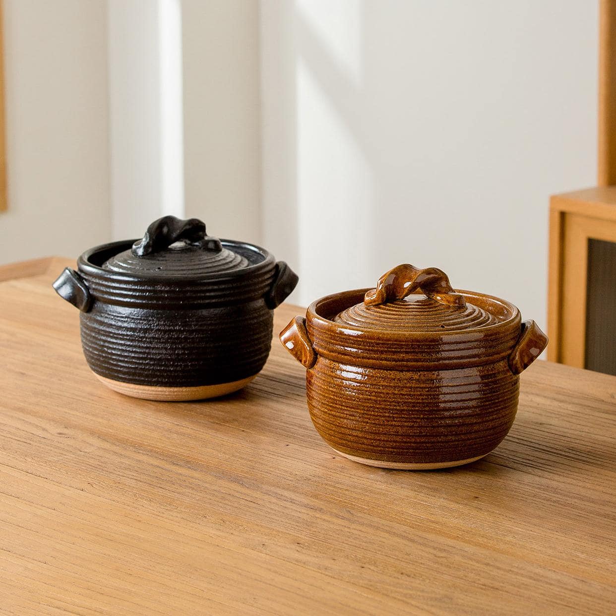 Authentic Japanese soup pot with knot-style lid and ergonomic handles