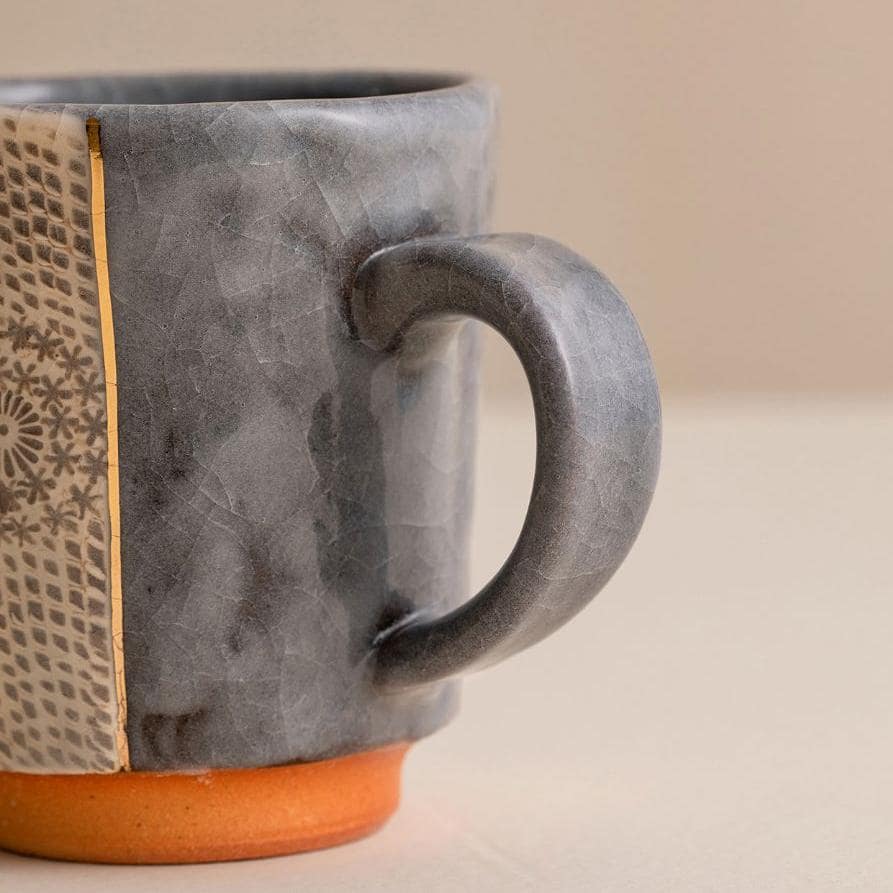 Elegant mug with a timeless design placed in a cozy setting.