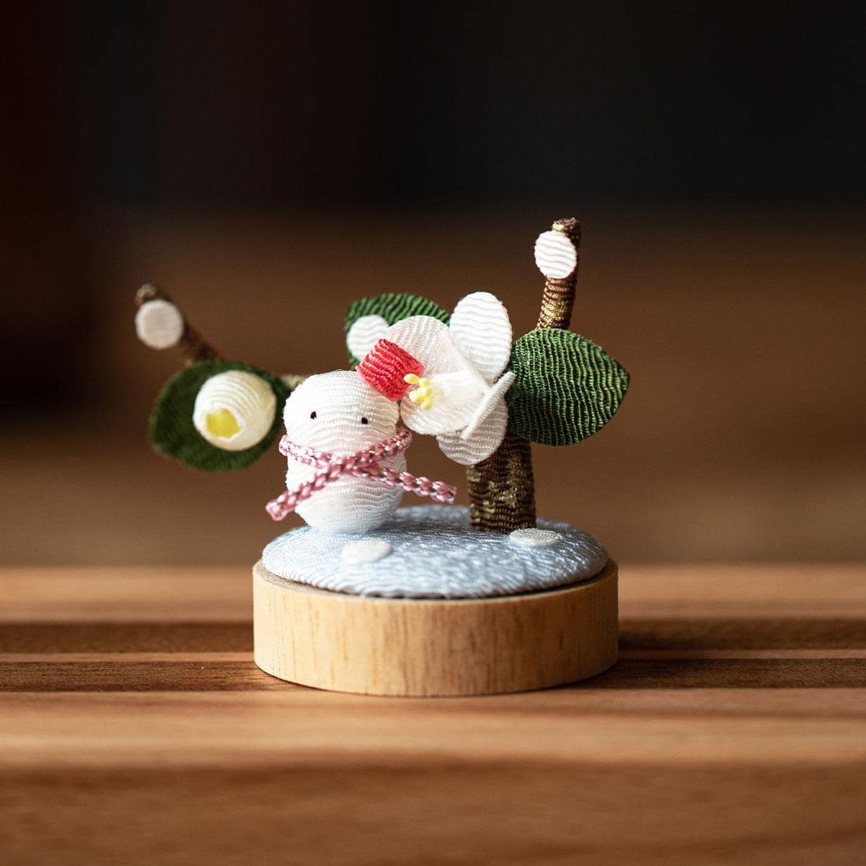 Cherry blossom and sunflower decor set on a shelf