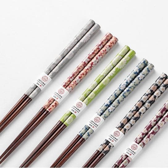 Matching couple chopsticks featuring cherry blossom patterns