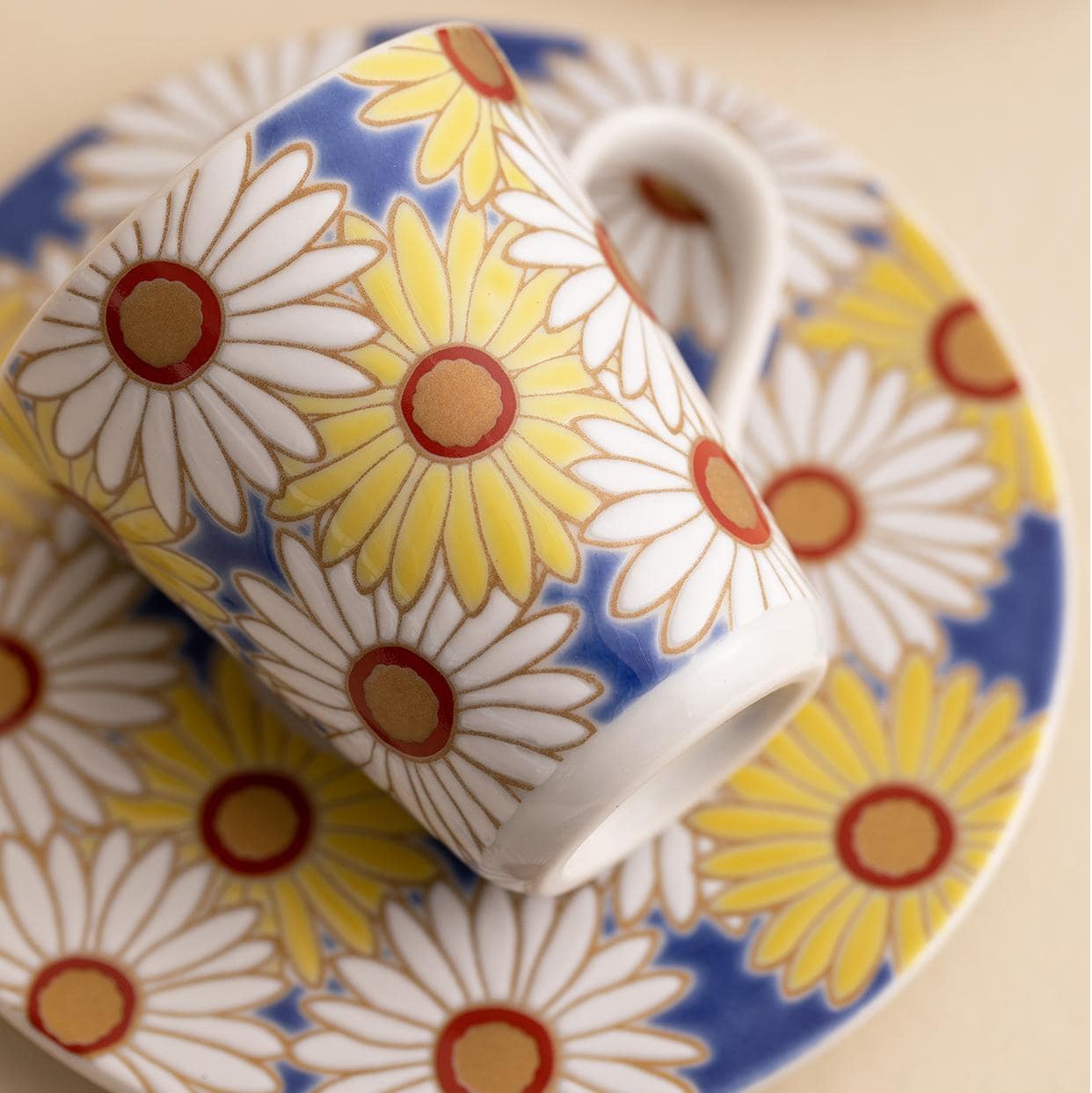 Floral espresso cup set with colorful saucers