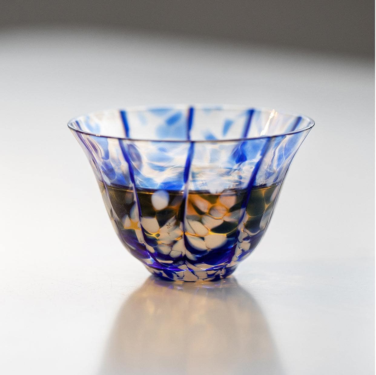 Overhead view of artistic glass cups with colorful patterns