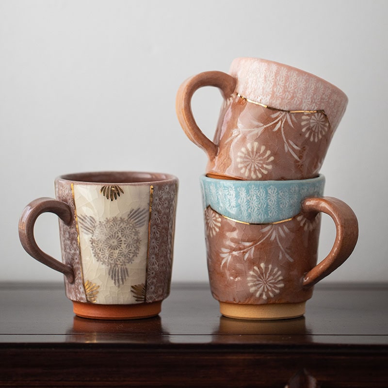 Elegant ceramic mugs stacked for aesthetic presentation