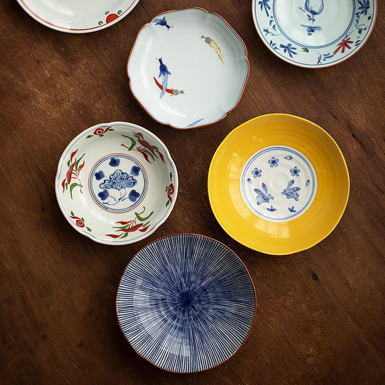 Vibrant porcelain plates showcasing traditional Japanese designs