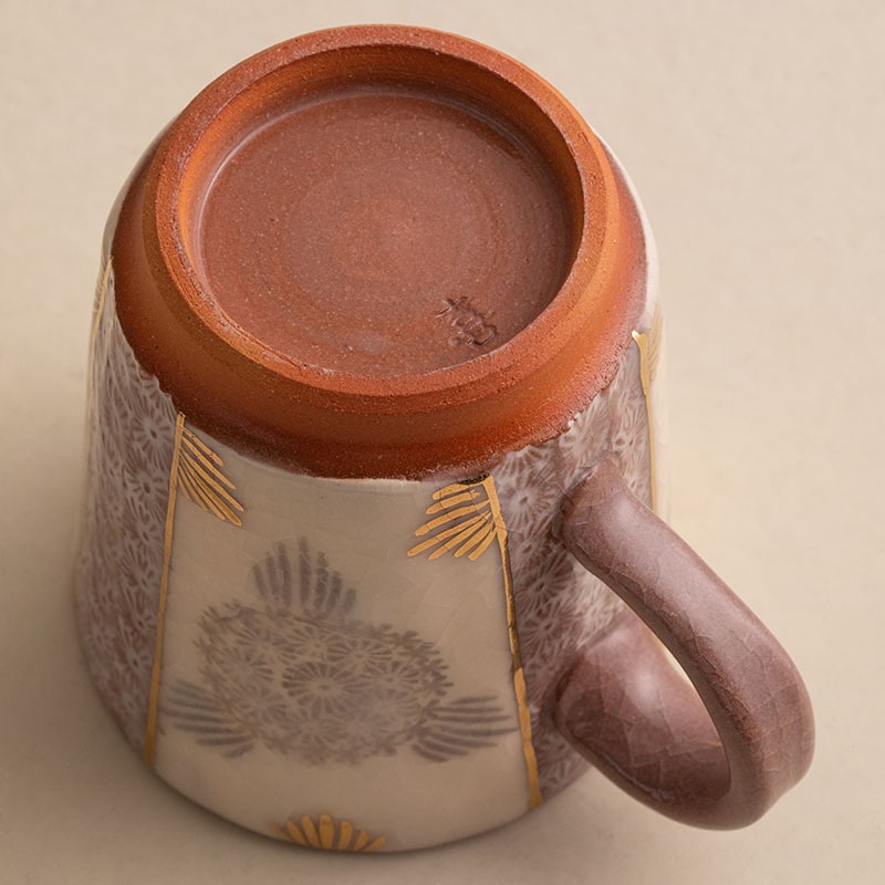 Artisanal ceramic mug collection featuring unique floral designs