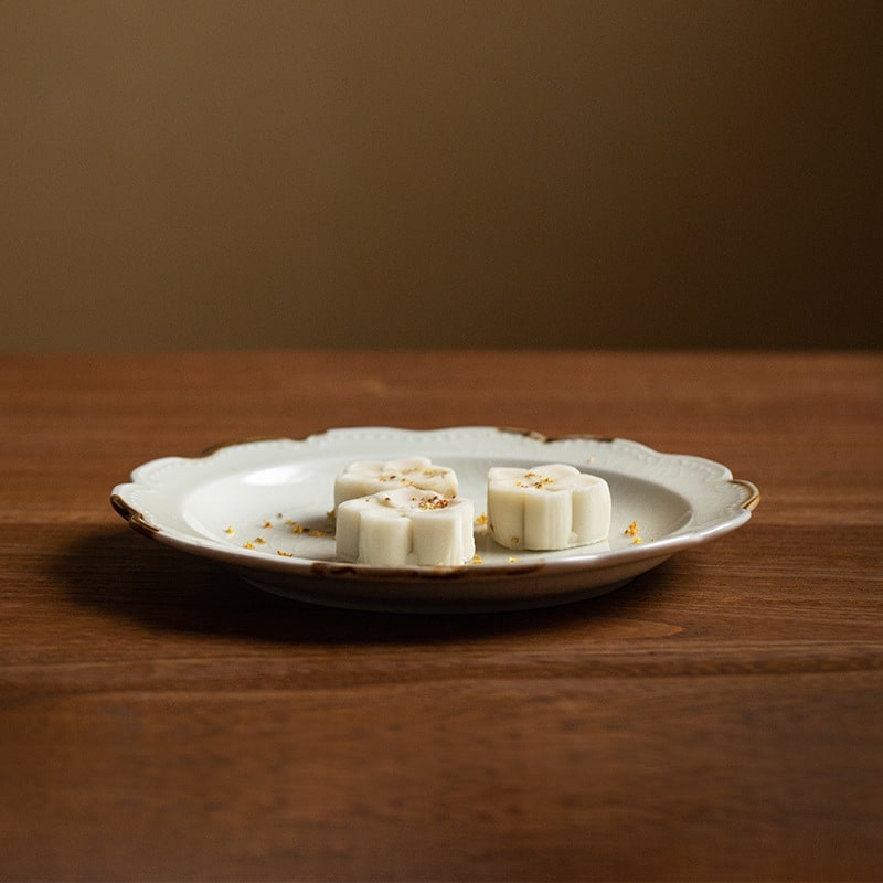 Artistic ceramic plate featuring elegant wavy edges.