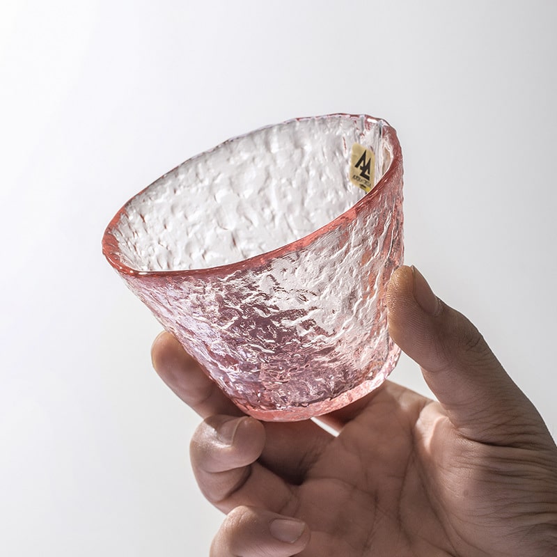 Textured pink glass cup for hot and cold drinks.