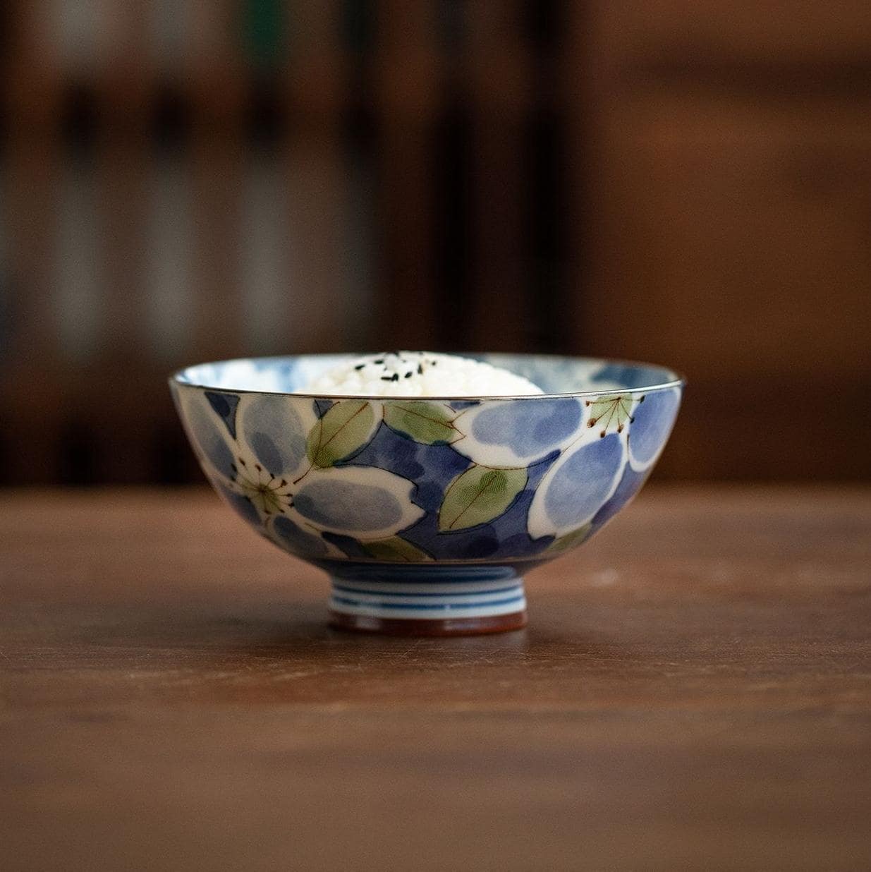 Blue floral ceramic bowl on a wooden table