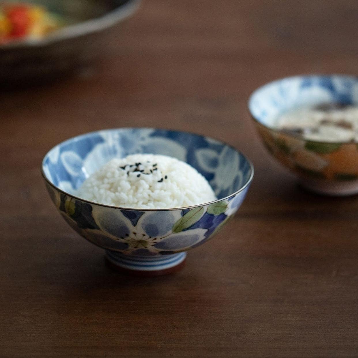 Peach and green floral ceramic bowl close-up