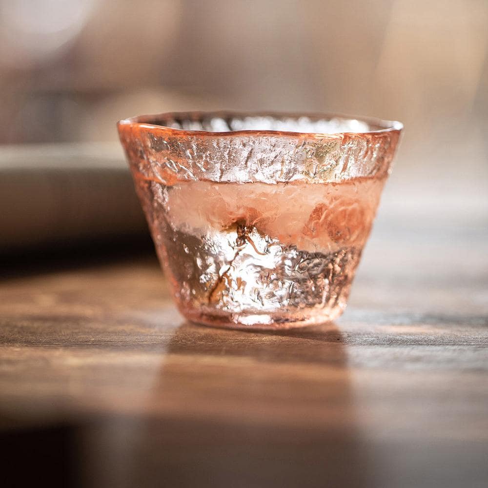 Handcrafted glass cup showcasing floral-inspired elegance.