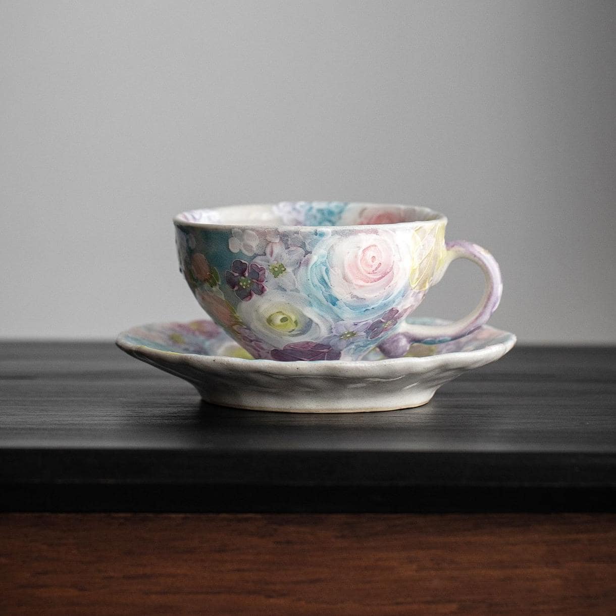 Japanese dance pottery tea cup and saucer with colorful hand-painted flowers