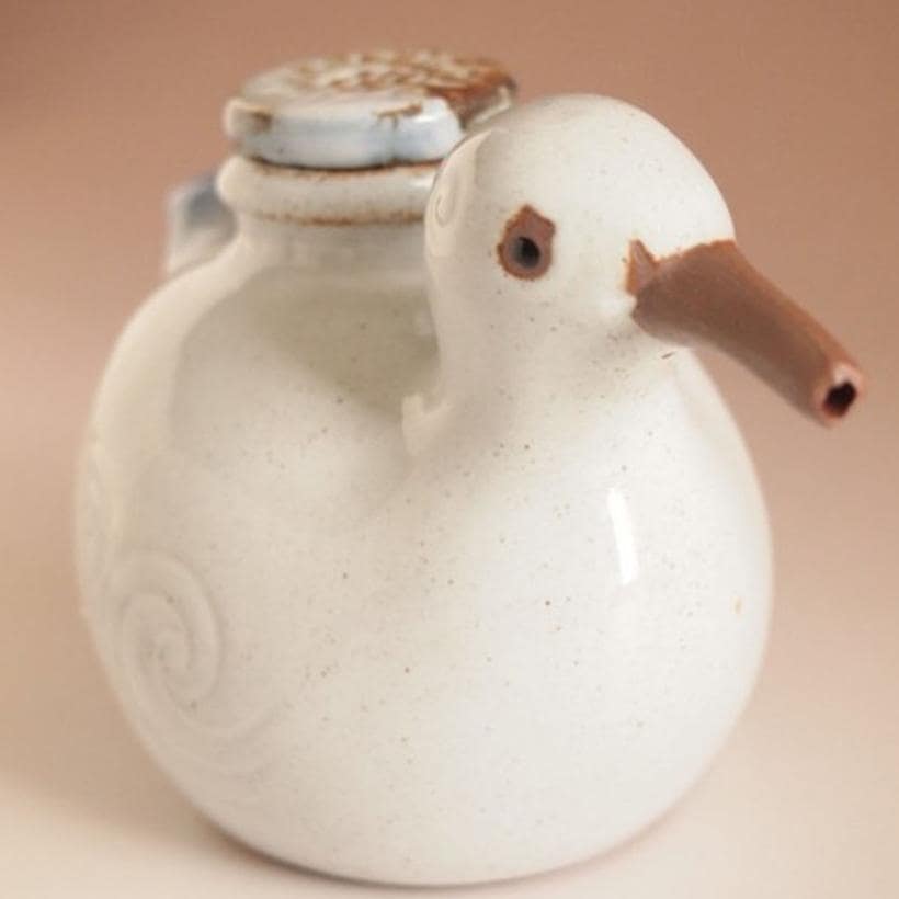 Whimsical ceramic bird oil pot used for soy sauce and oils.