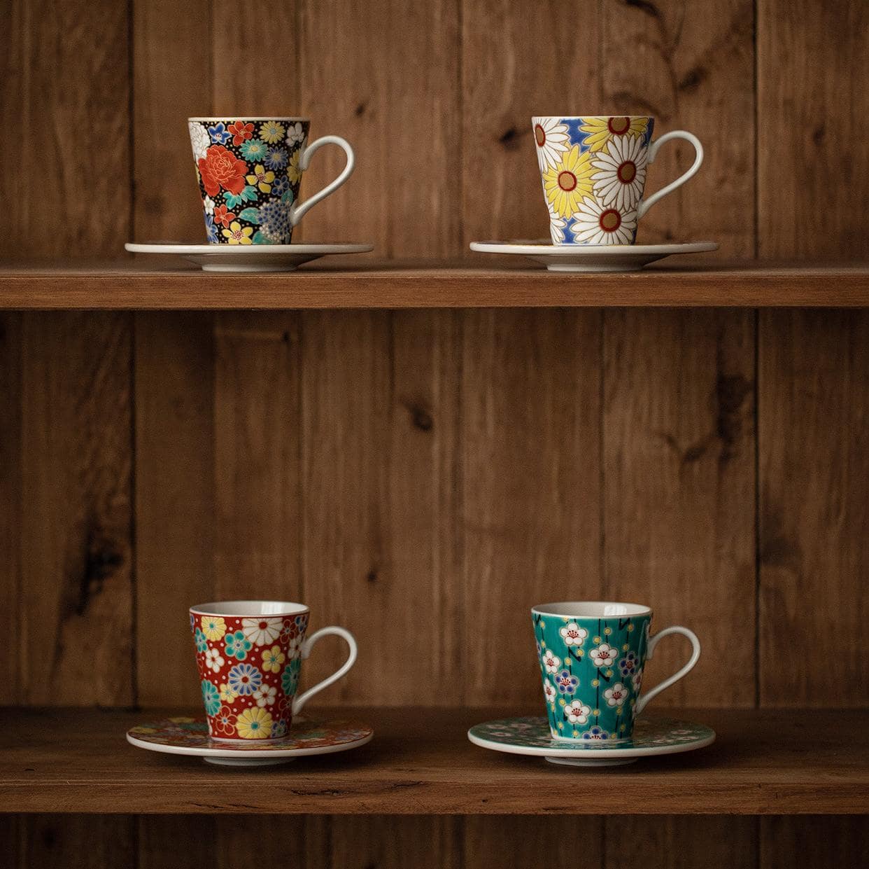 Artistic floral porcelain cup and matching saucer