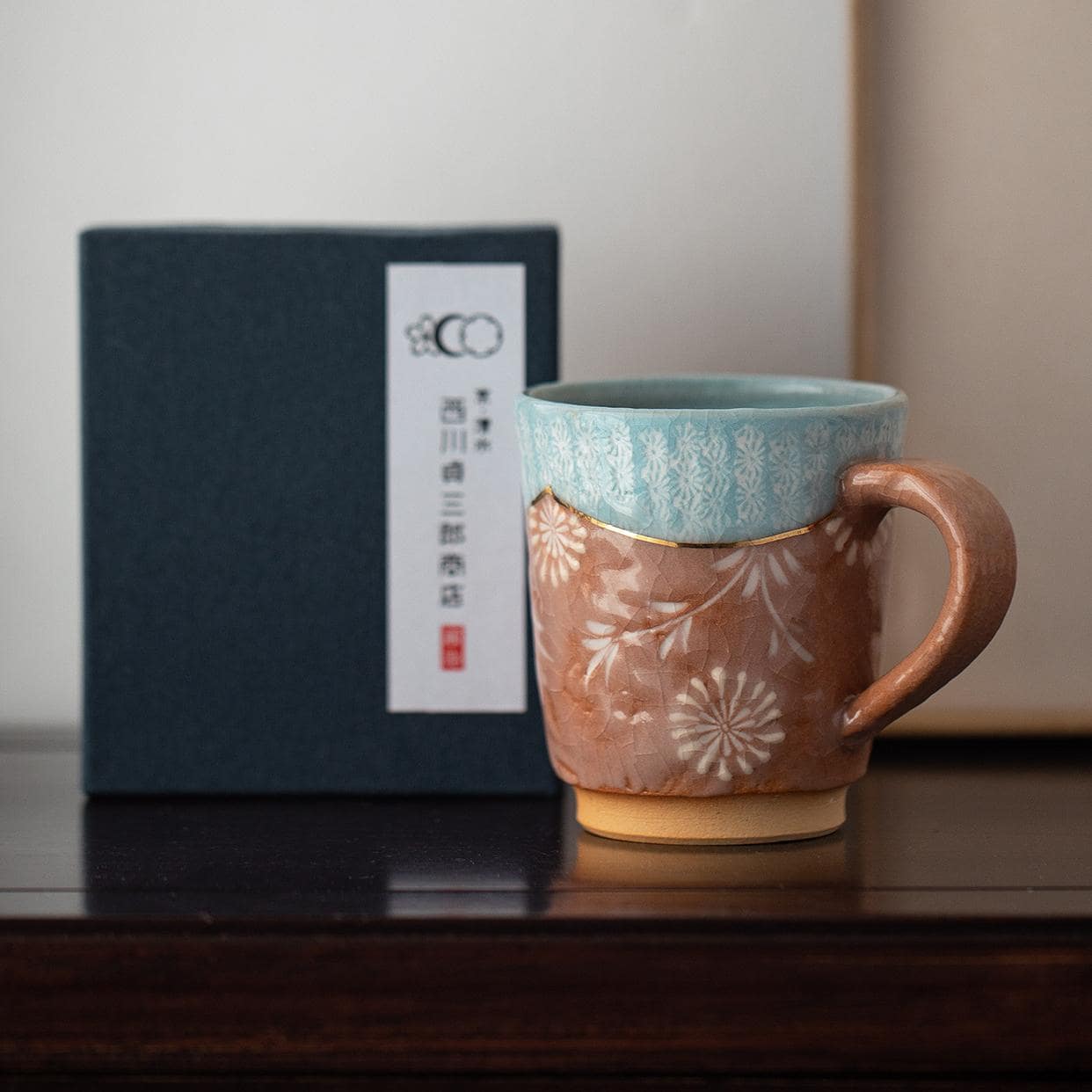 Vintage-inspired ceramic mug with ergonomic handle and crackle glaze