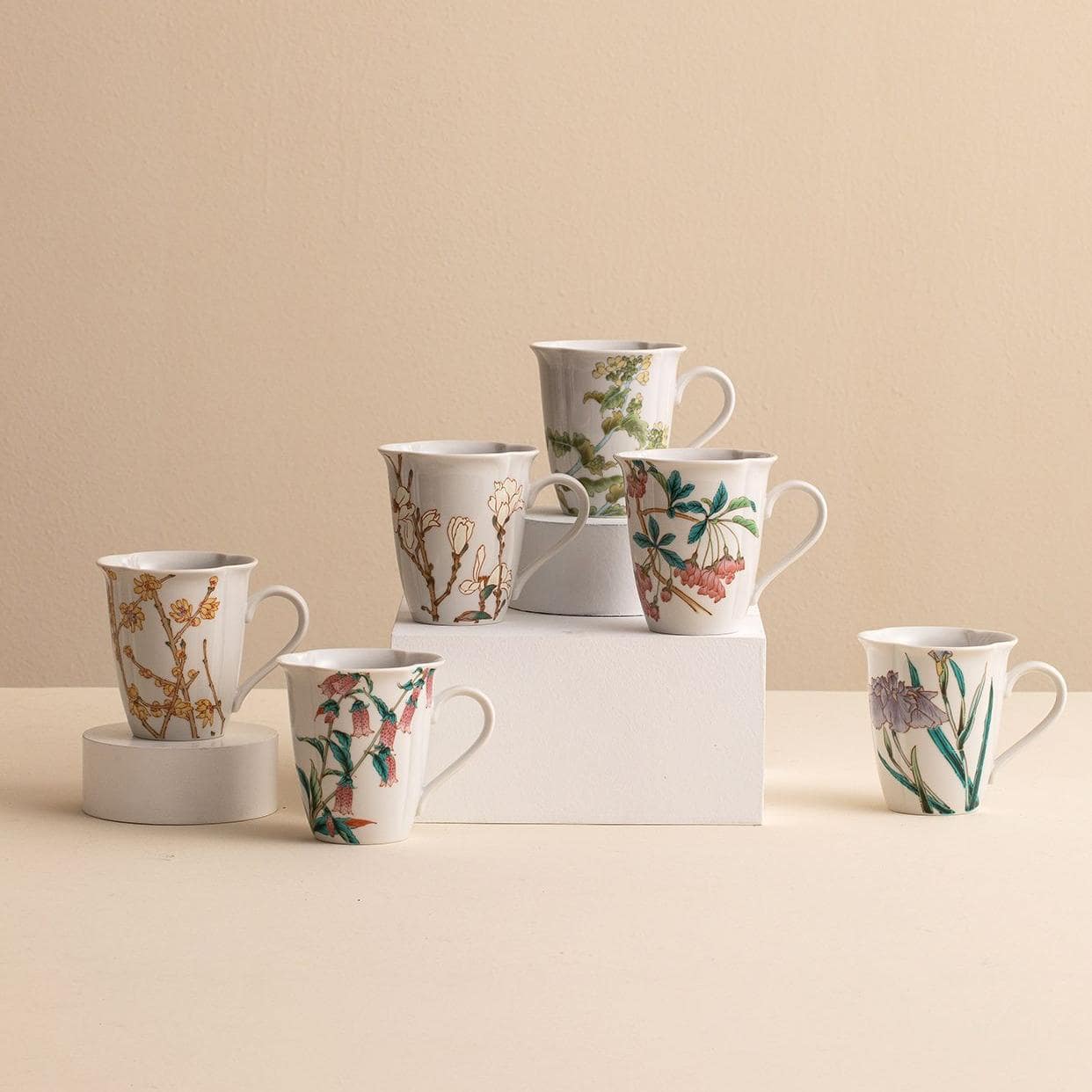 Handcrafted ceramic mug with golden floral patterns