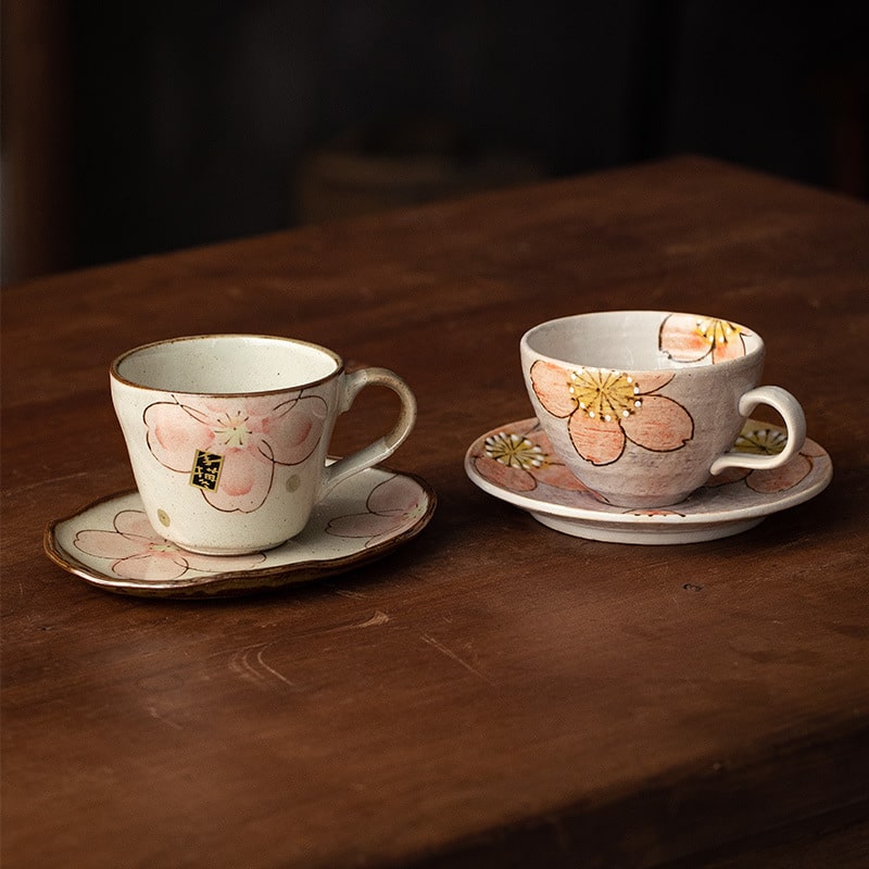 Spring-inspired sakura tea cup and saucer on a wooden table.