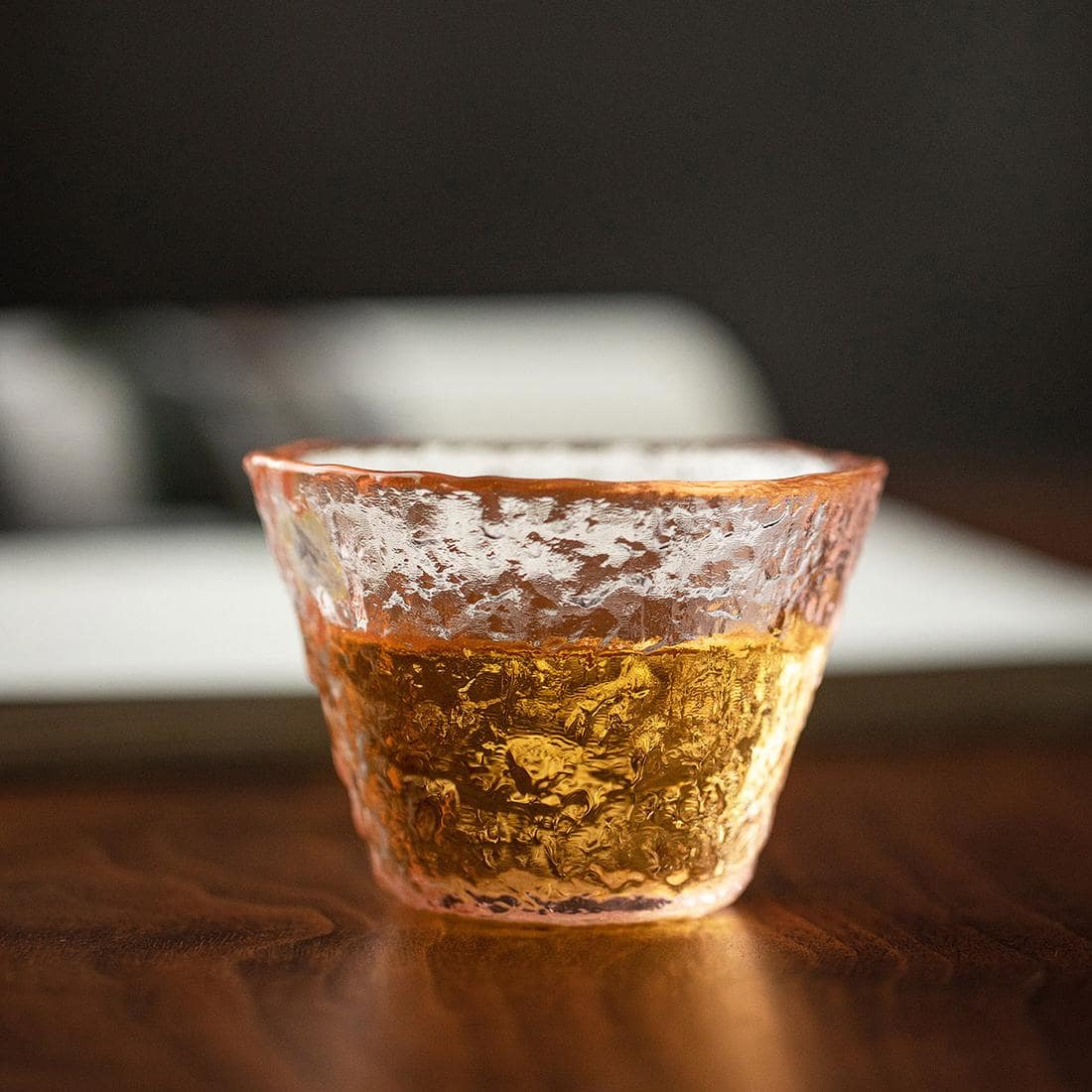 Handcrafted glass cup showcasing floral-inspired elegance.