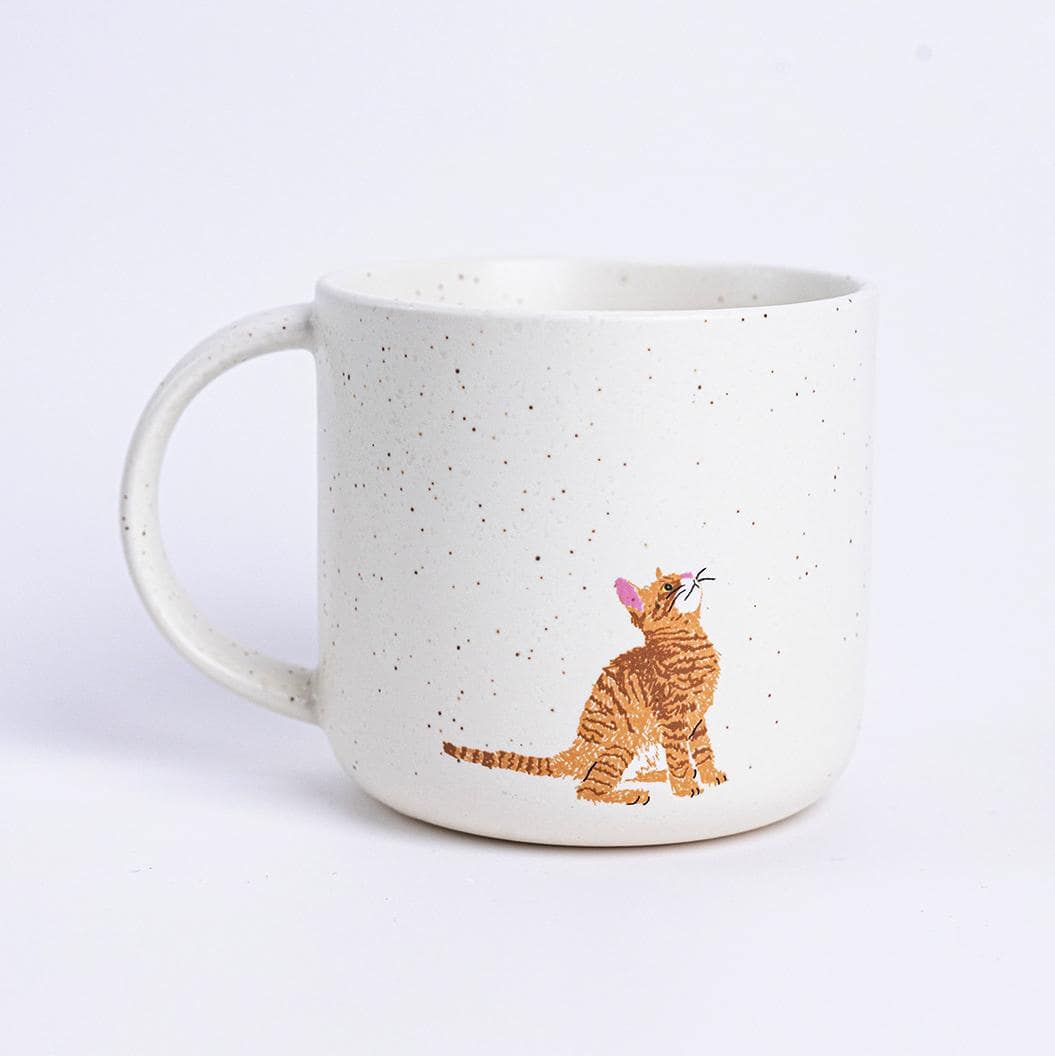 Brown ceramic mug featuring a stretching calico cat design.