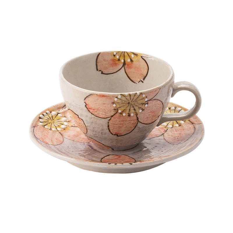 Artistic ceramic tea cup set featuring a delicate floral pattern.