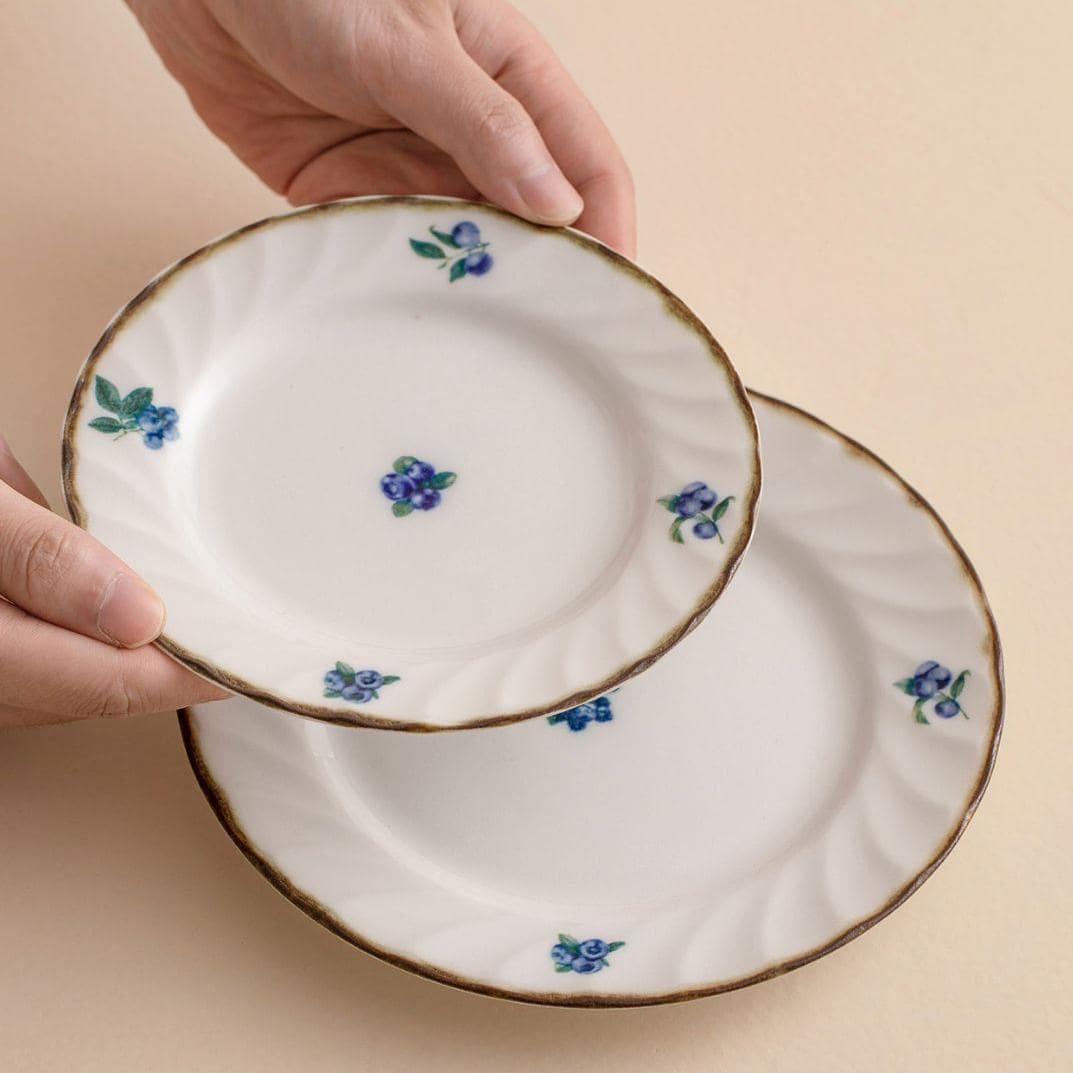 Artistic underglaze Japanese deep plates for versatile dining.