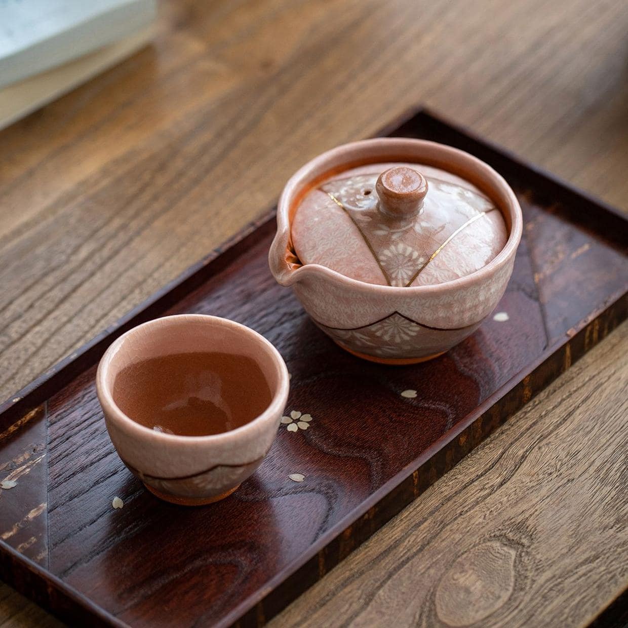 Elegant blue and brown ceramic tea set for luxury tea moments.