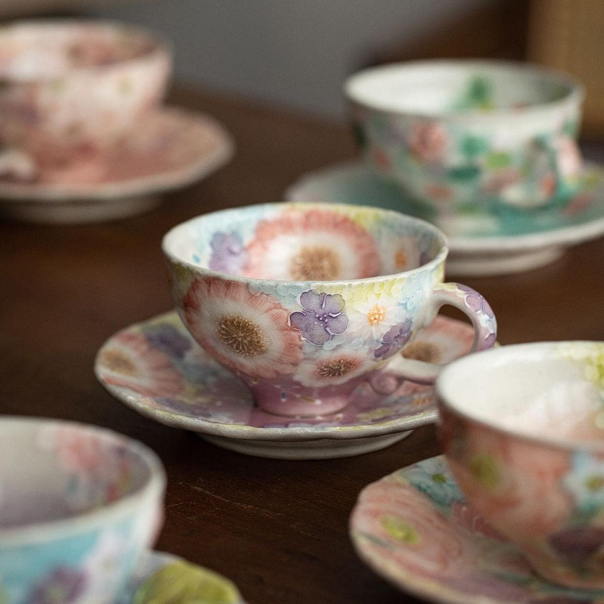 Hand-painted Japanese floral tea cup with saucer in pastel tones