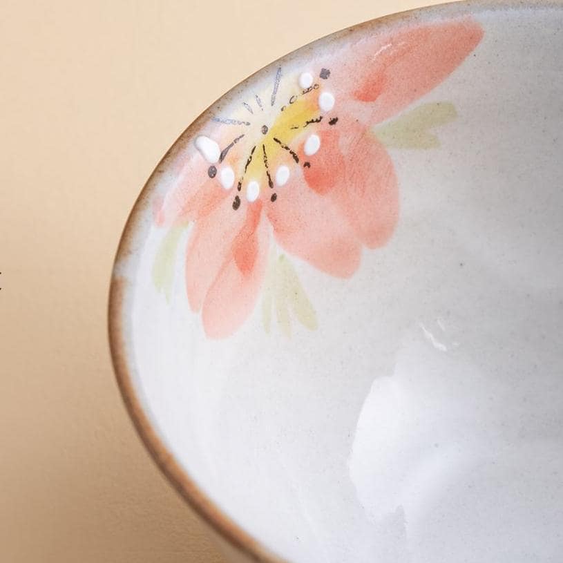 Elegant hand-painted ceramic cup with pastel sakura flowers.