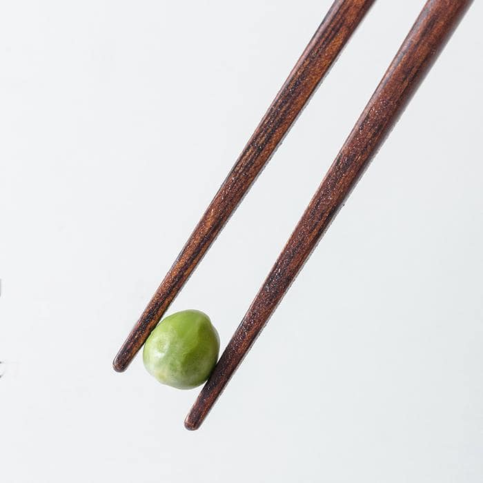 Elegant dining setup with wooden chopsticks