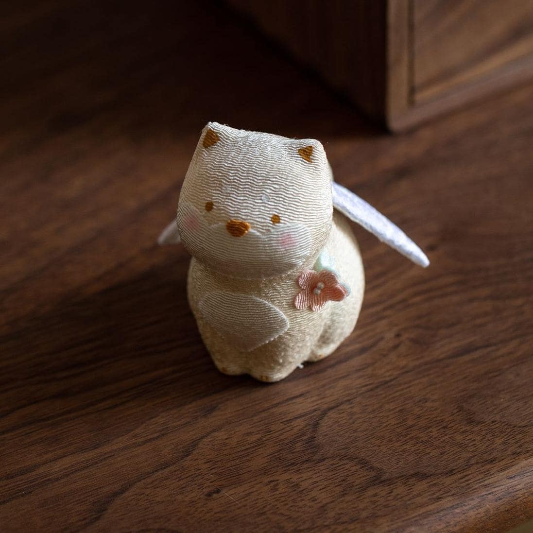 Handcrafted Japanese lucky cat ornament with bird accent