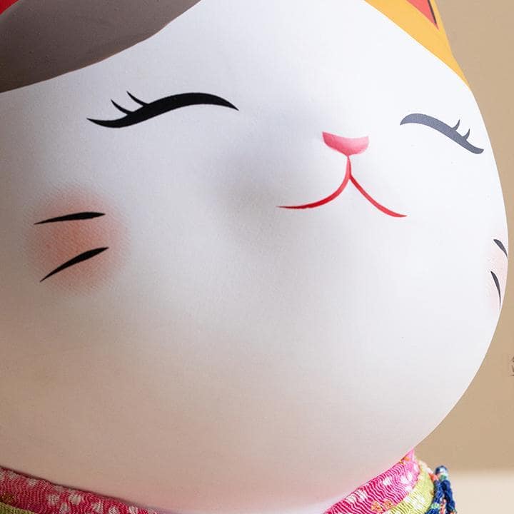 Japanese-style lucky cat with raised paw for good fortune