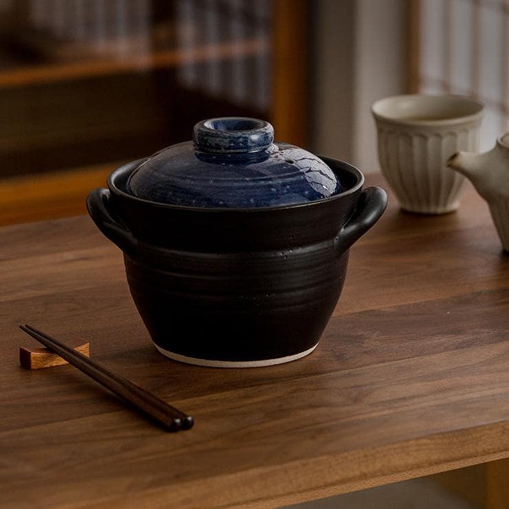 Open Japanese sand pot showing double-layered lid design.