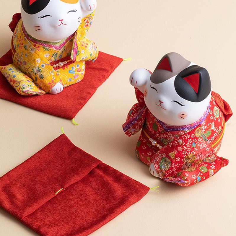 Living room ceramic lucky cat in vibrant red and gold tones